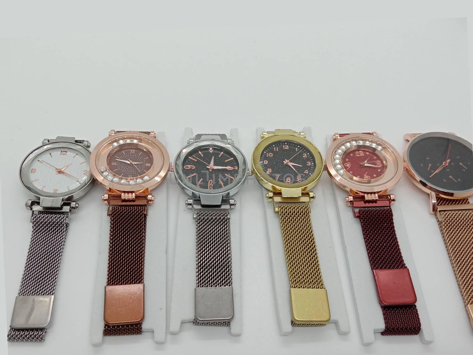 multiple colored watch stock on gray background