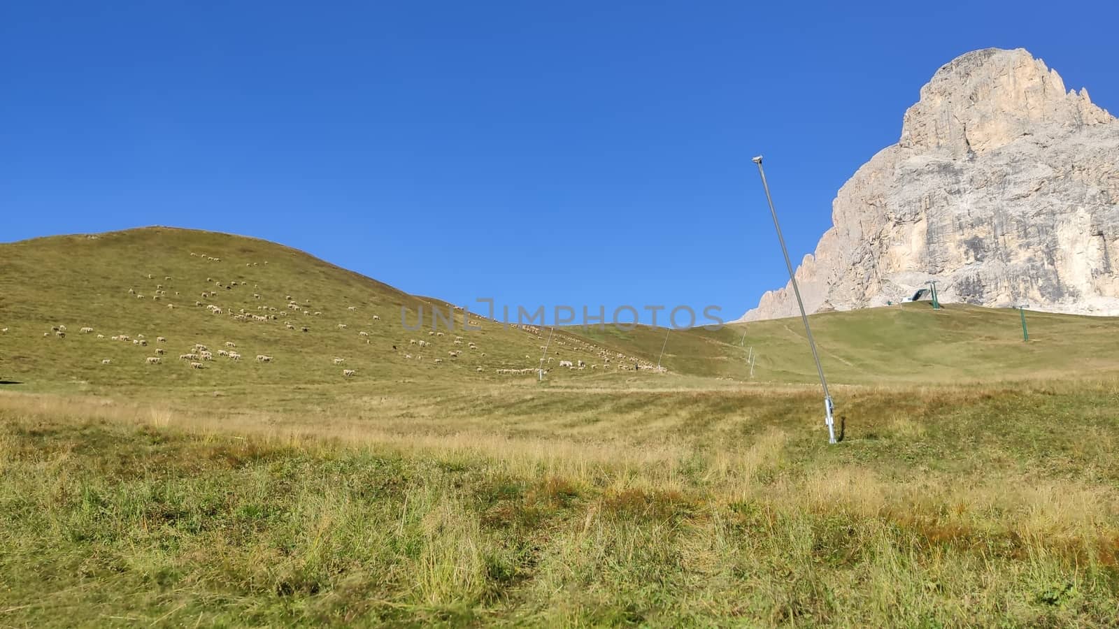 Val Gardena, Italy - 09/15/2020: Scenic alpine place with magical Dolomites mountains in background, amazing clouds and blue sky in Trentino Alto Adige region, Italy, Europe