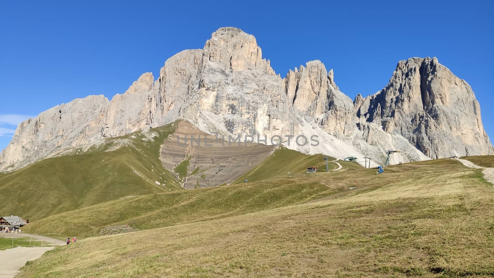 Val Gardena, Italy - 09/15/2020: Scenic alpine place with magical Dolomites mountains in background, amazing clouds and blue sky in Trentino Alto Adige region, Italy, Europe