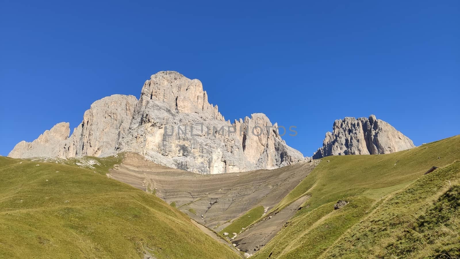 Val Gardena, Italy - 09/15/2020: Scenic alpine place with magical Dolomites mountains in background, amazing clouds and blue sky in Trentino Alto Adige region, Italy, Europe