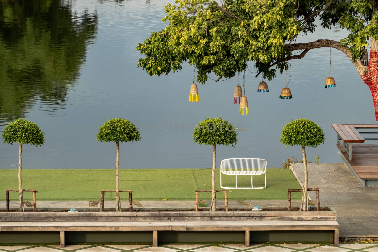 chair near river and green view.