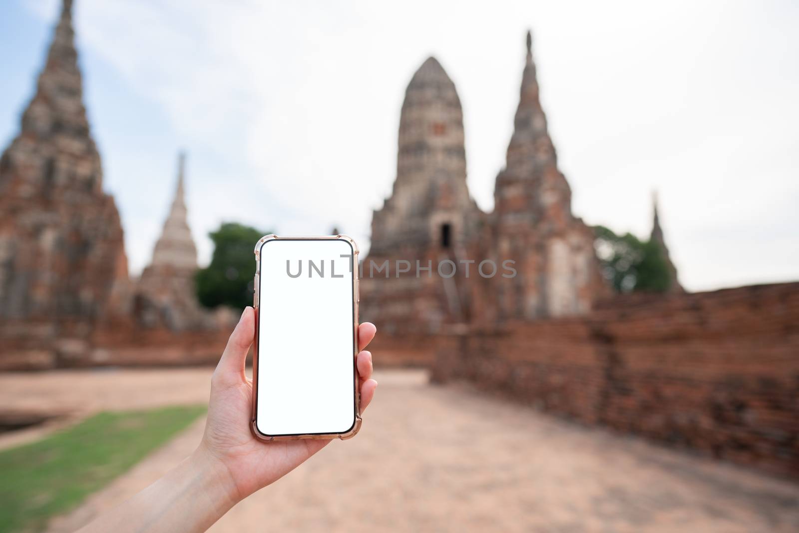 Mockup image of hand holding mobile phone with blank white screen with Pagoda.