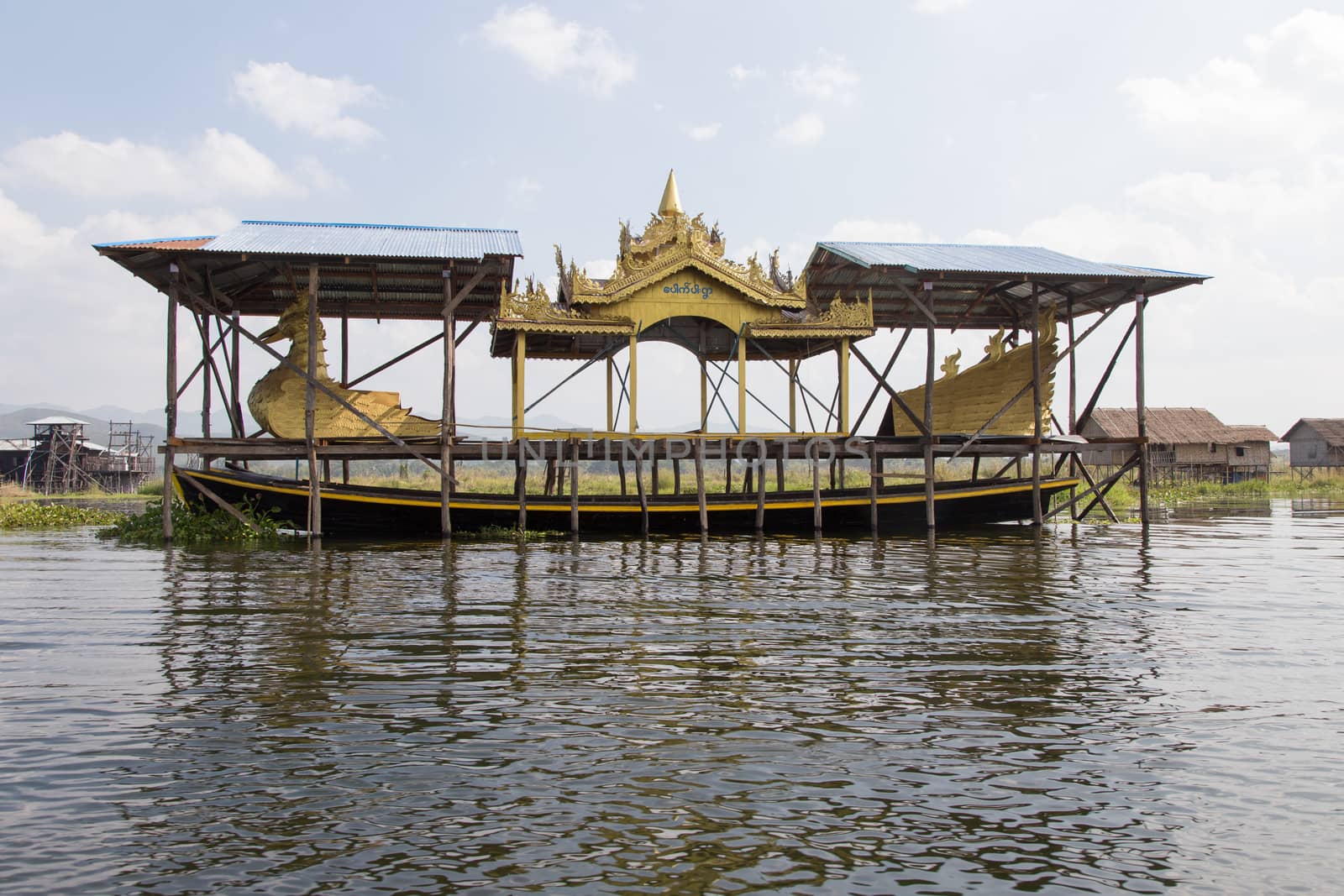 Inle Lake Myanmar 12/16/2015 with ceremonial boat under cover by kgboxford