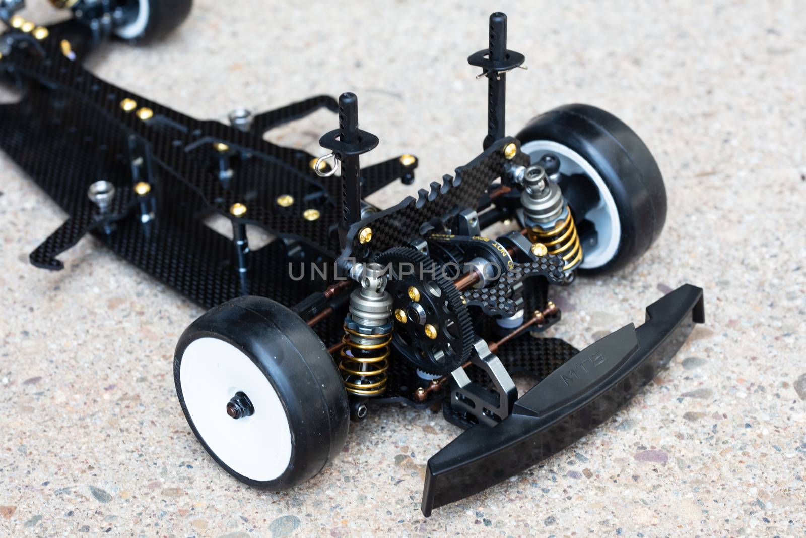 RC car chassis and parts being built to form a radio controlled race car.