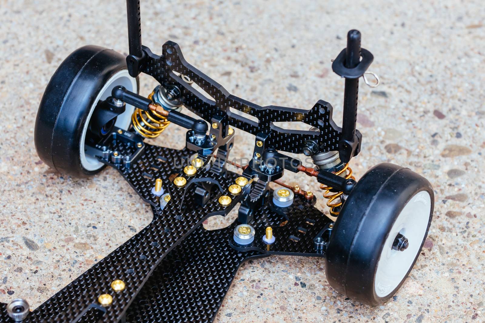 RC car chassis and parts being built to form a radio controlled race car.