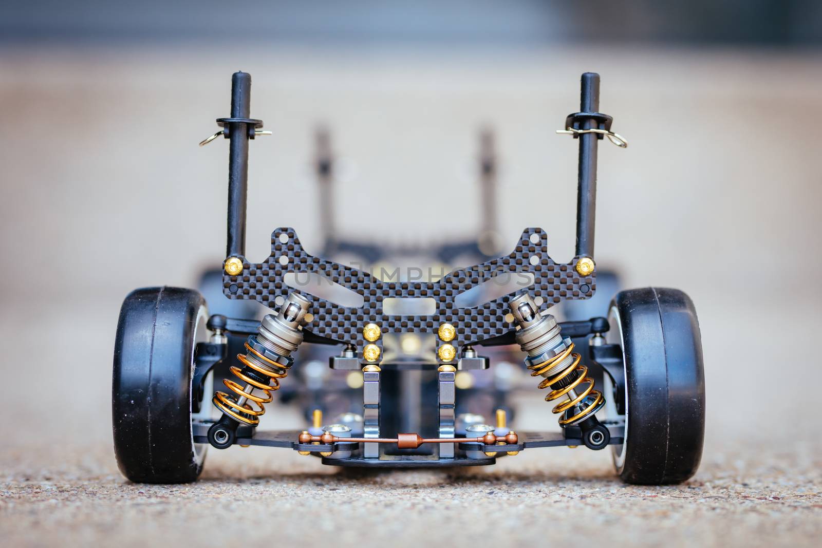 RC car chassis and parts being built to form a radio controlled race car.
