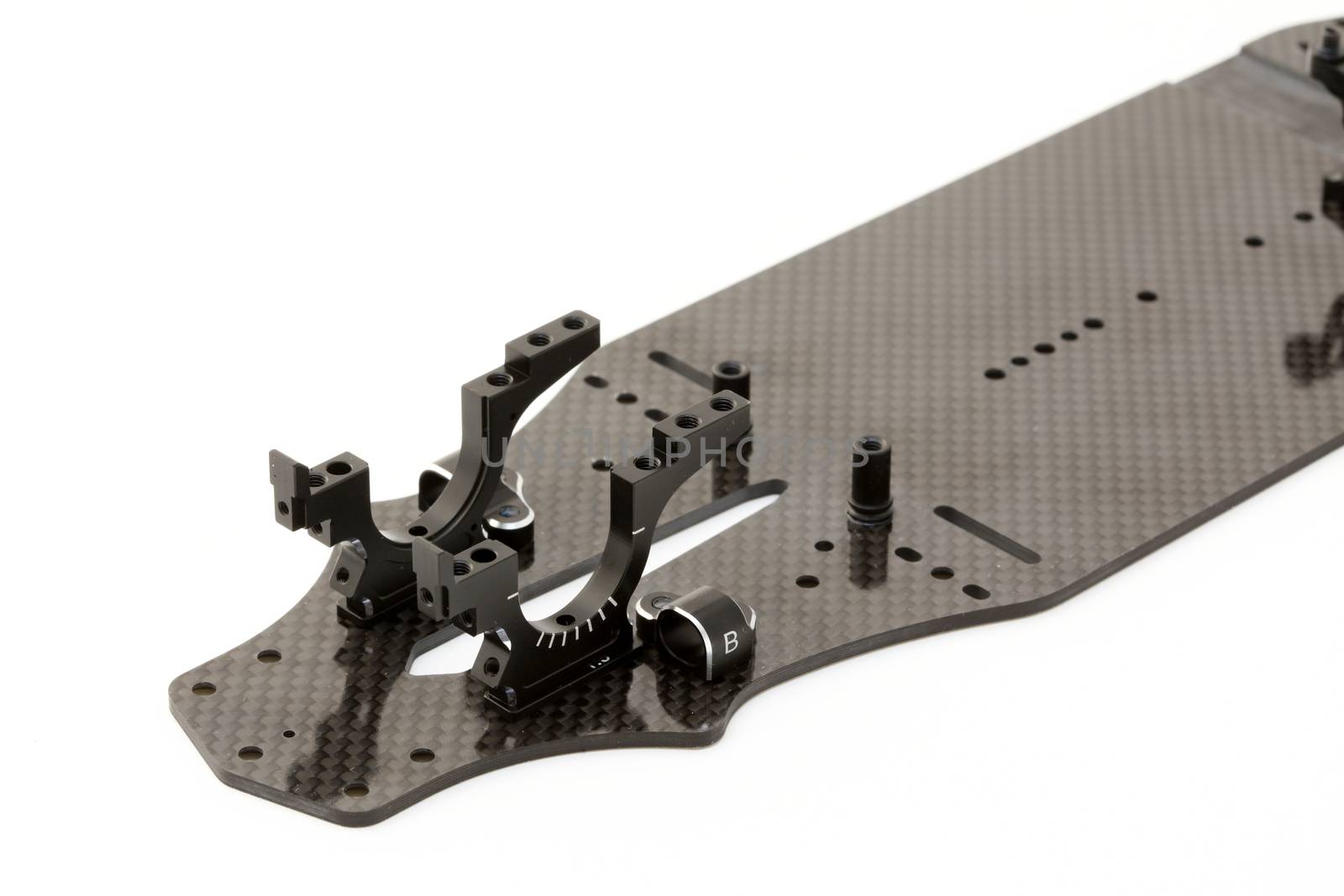 RC car chassis and parts being built to form a radio controlled race car.