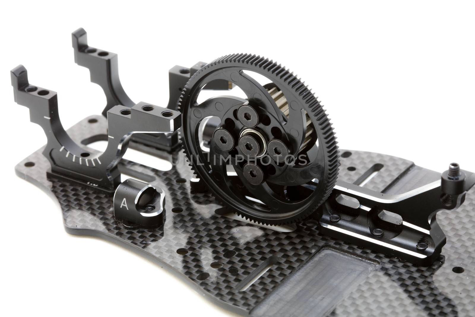 RC car chassis and parts being built to form a radio controlled race car.