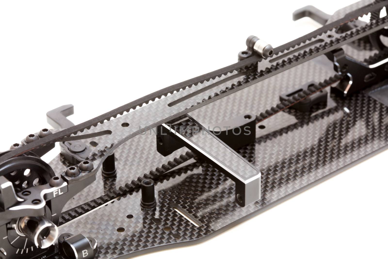 RC car chassis and parts being built to form a radio controlled race car.