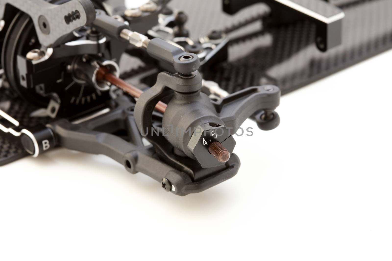RC car chassis and parts being built to form a radio controlled race car.