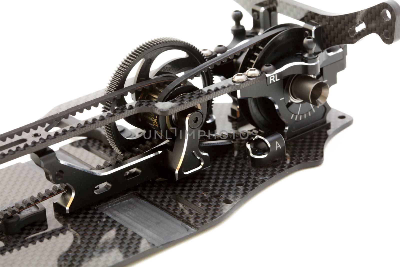 RC car chassis and parts being built to form a radio controlled race car.