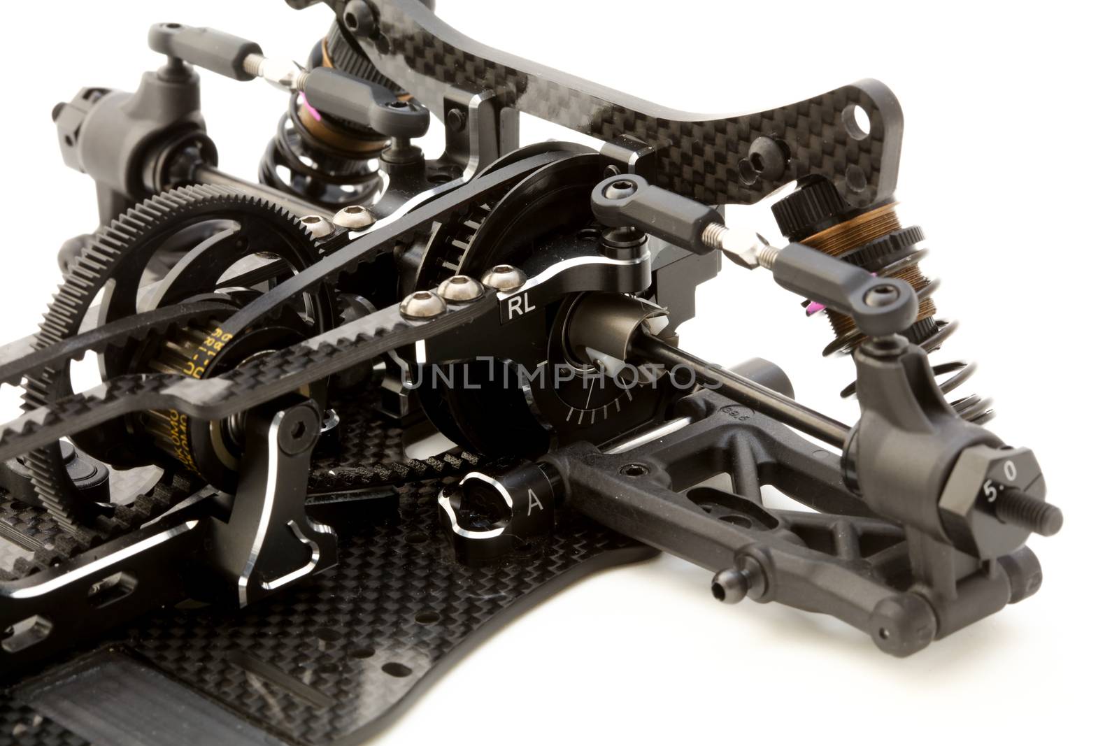 RC car chassis and parts being built to form a radio controlled race car.