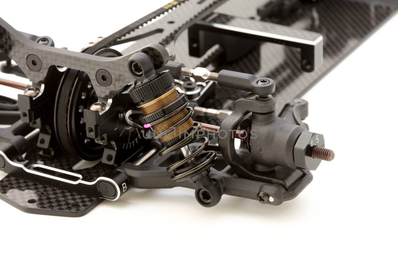 RC car chassis and parts being built to form a radio controlled race car.