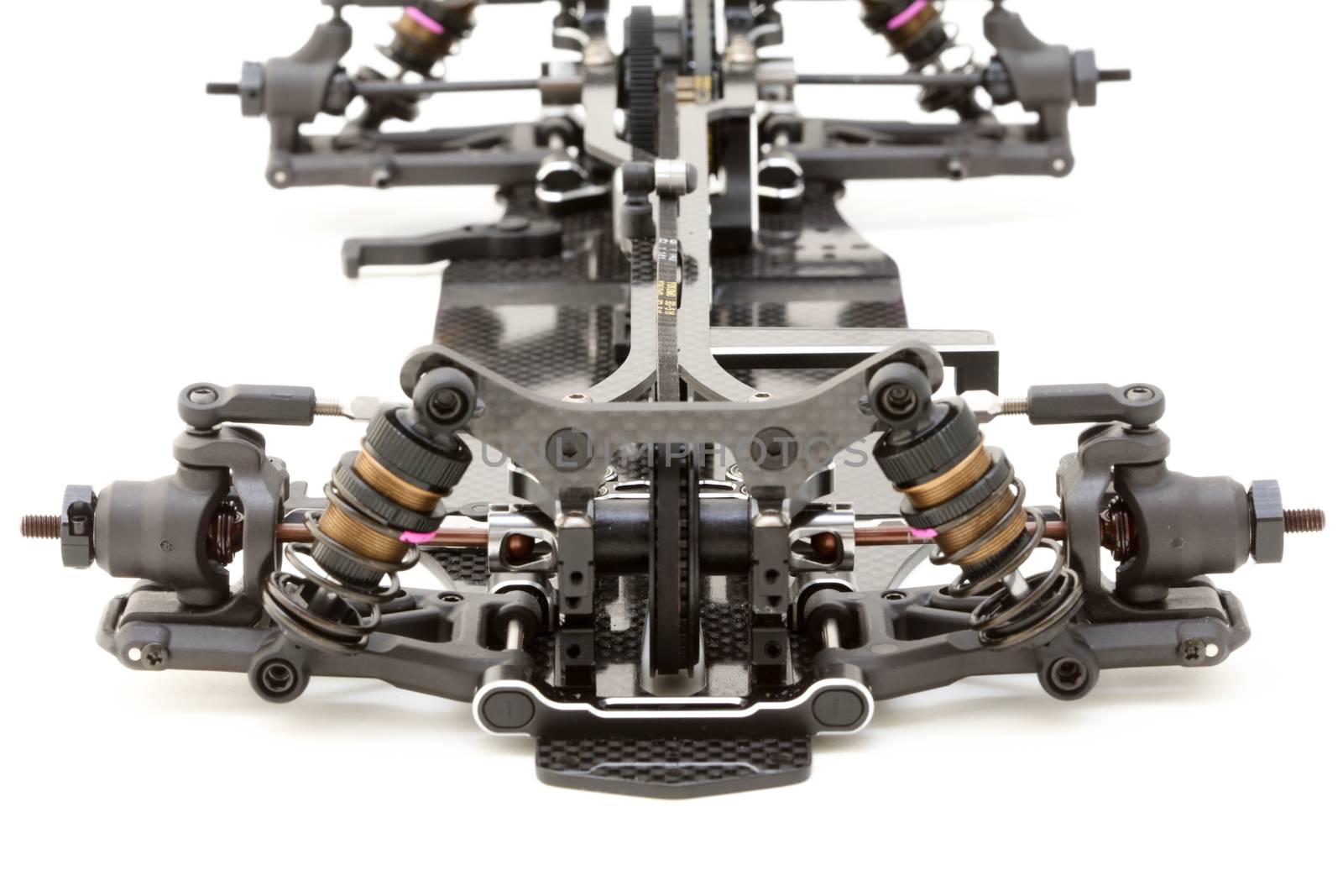 RC car chassis and parts being built to form a radio controlled race car.