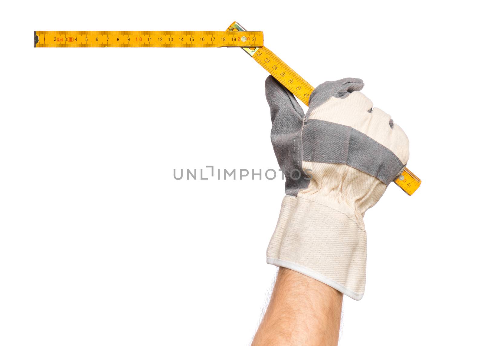 Male Hand wearing Working Glove with yellow wooden meter. Human Hand holding tool, Isolated on White Background.