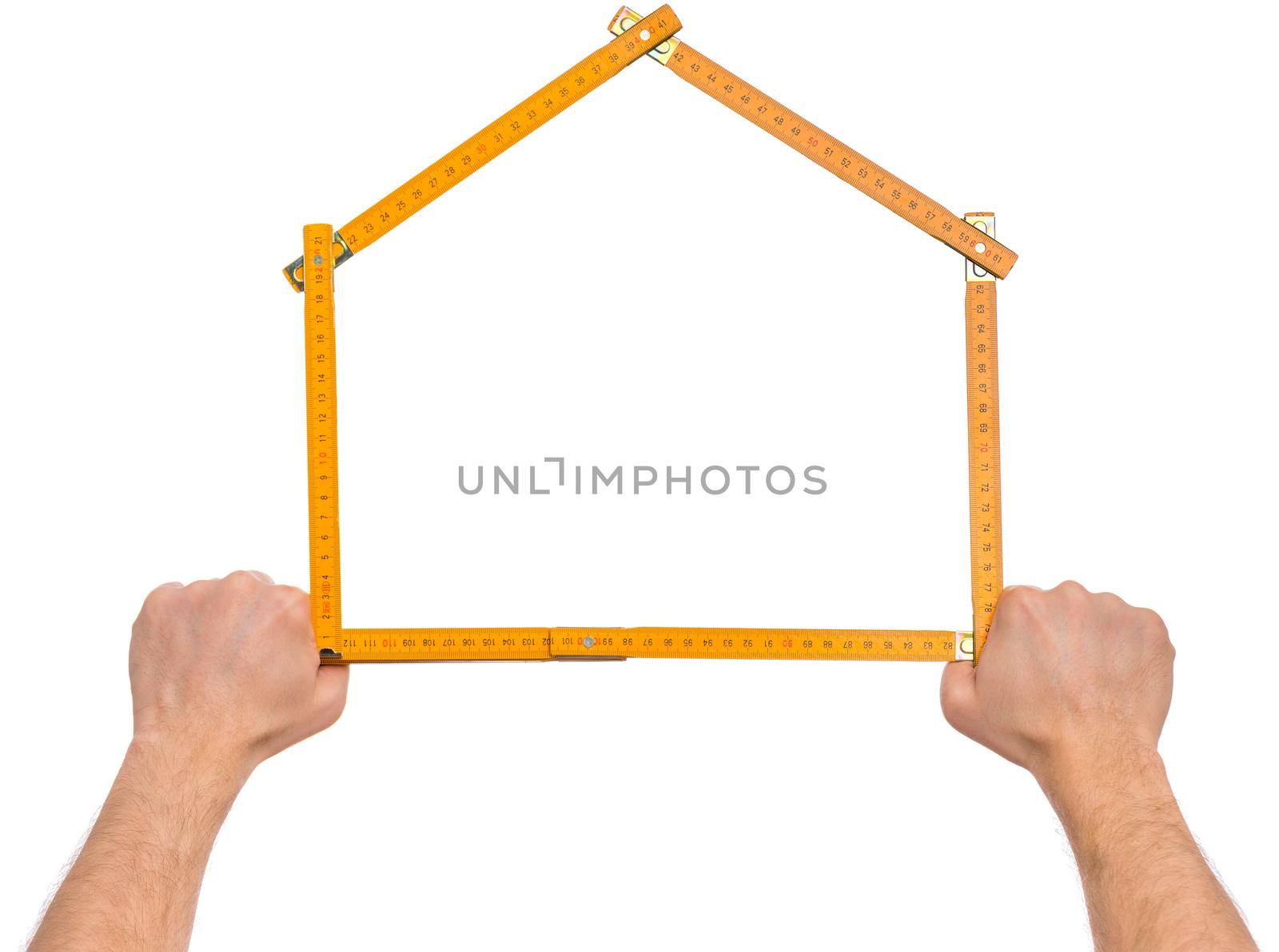 Male Hand with yellow wooden meter. Human Hand holding tool forming a house, Isolated on White Background.