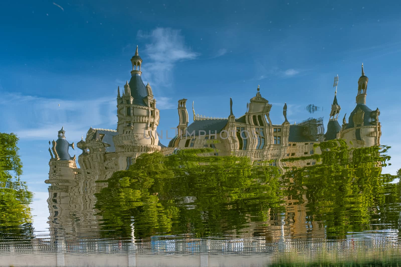 Beautiful fairytale castle in Schwerin, reflected in the lake.