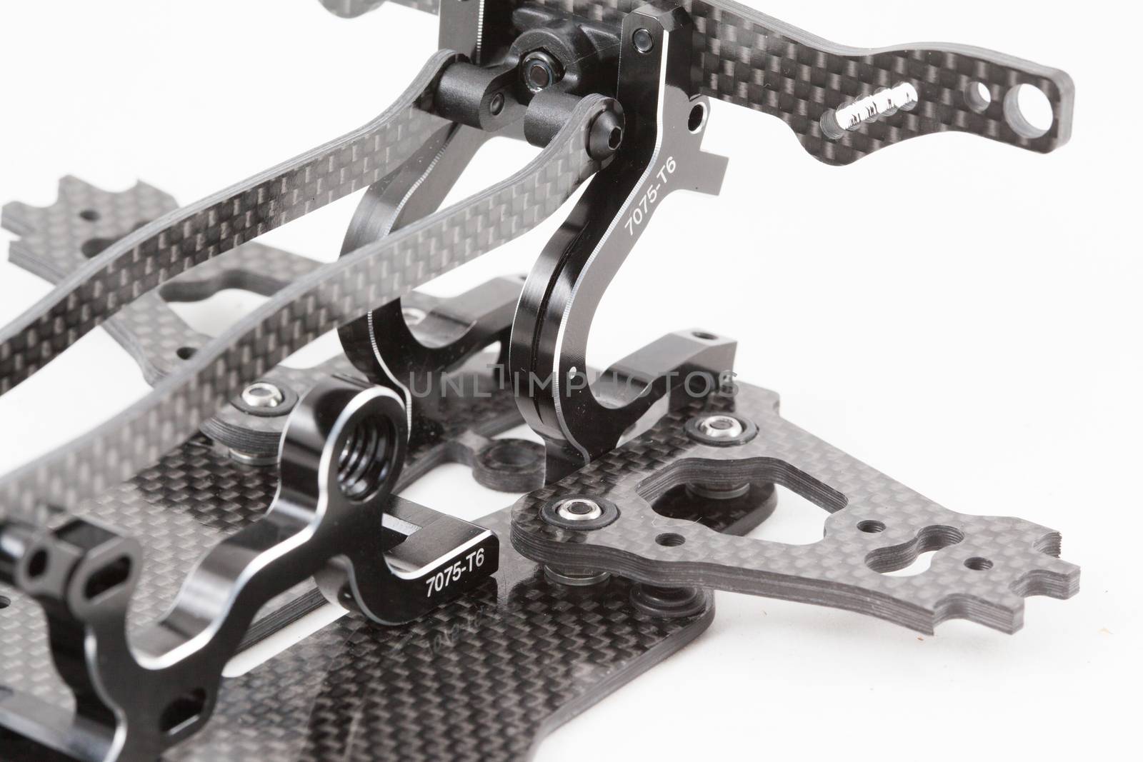 RC car chassis and parts being built to form a radio controlled race car.
