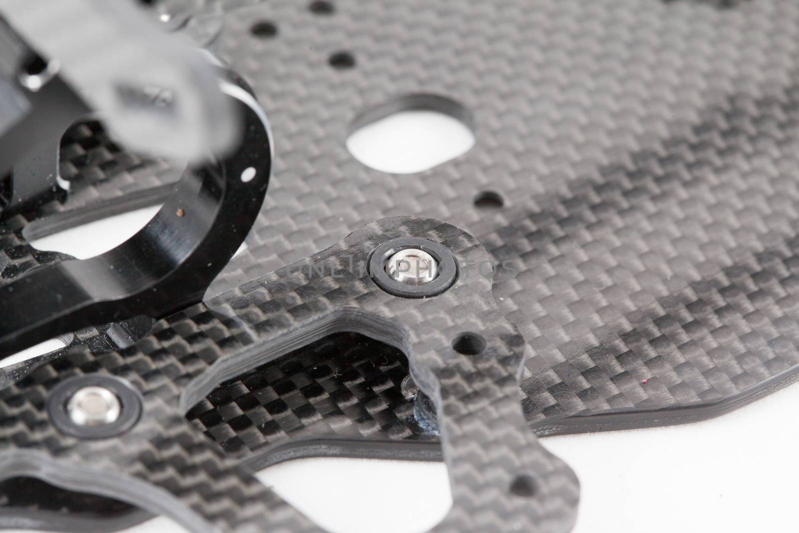 RC car chassis and parts being built to form a radio controlled race car.