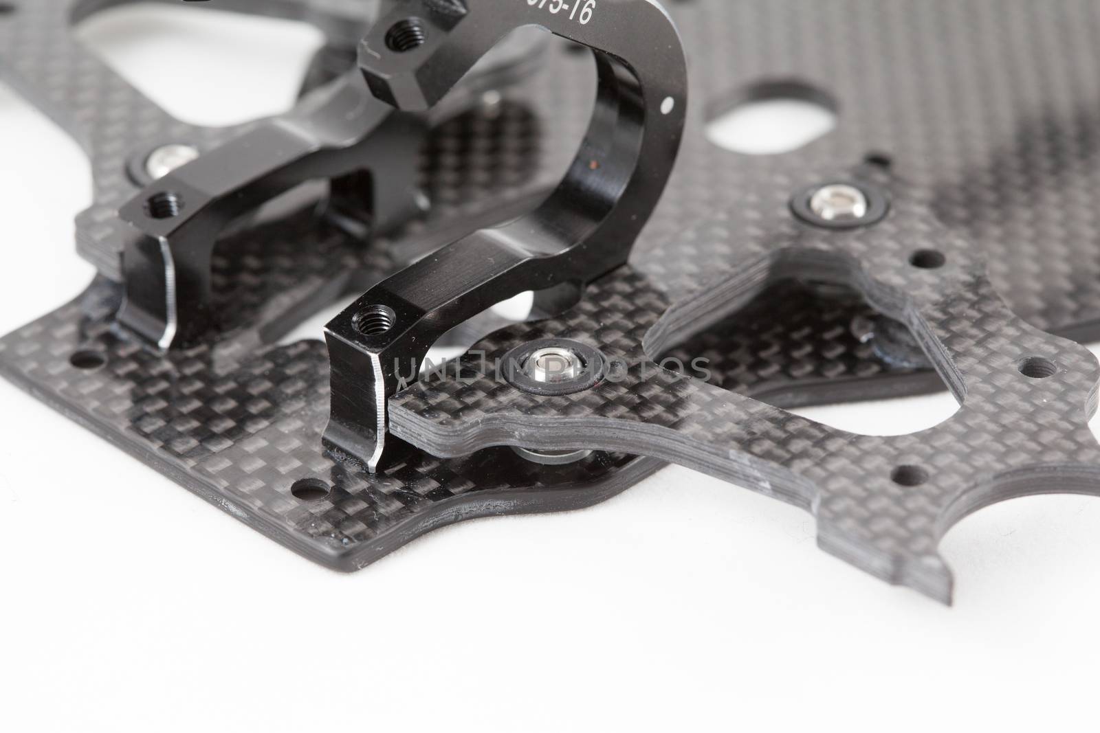 RC car chassis and parts being built to form a radio controlled race car.