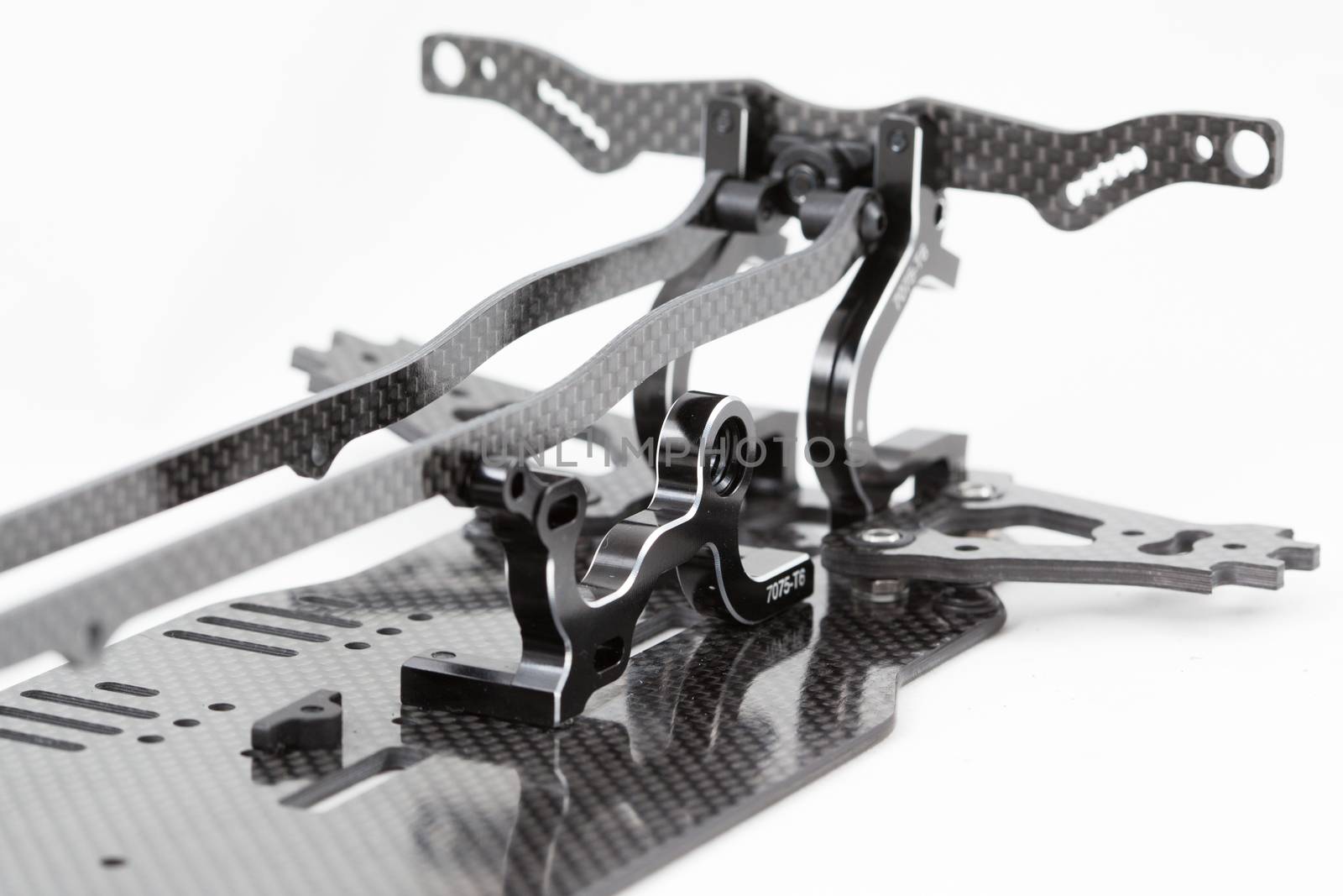 RC car chassis and parts being built to form a radio controlled race car.