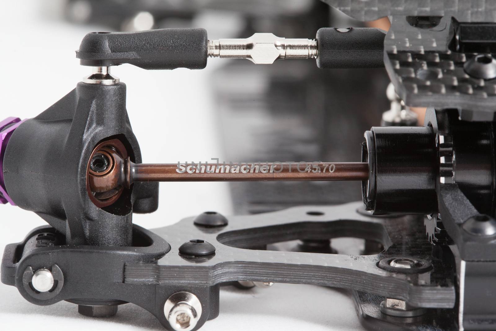 RC car chassis and parts being built to form a radio controlled race car.
