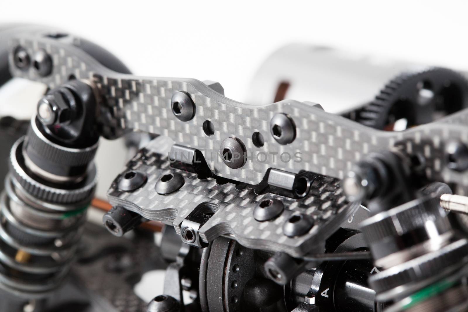 RC car chassis and parts being built to form a radio controlled race car.