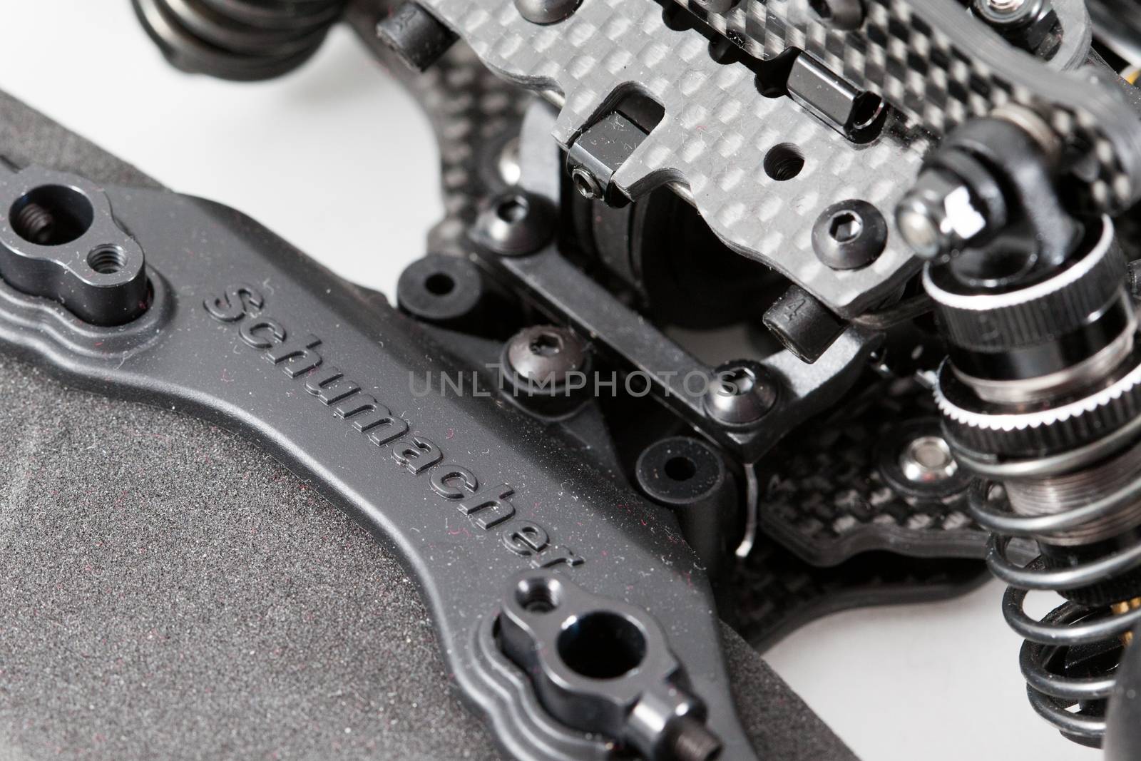 RC car chassis and parts being built to form a radio controlled race car.