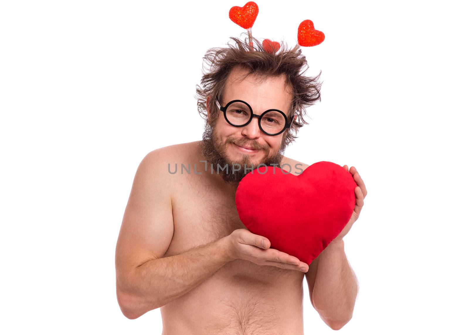 Happy Valentines Day. Crazy bearded Man with funny Haircut in eye Glasses. Happy and silly guy in Love, isolated on white background. Cheerful naked man with Red plush Heart.