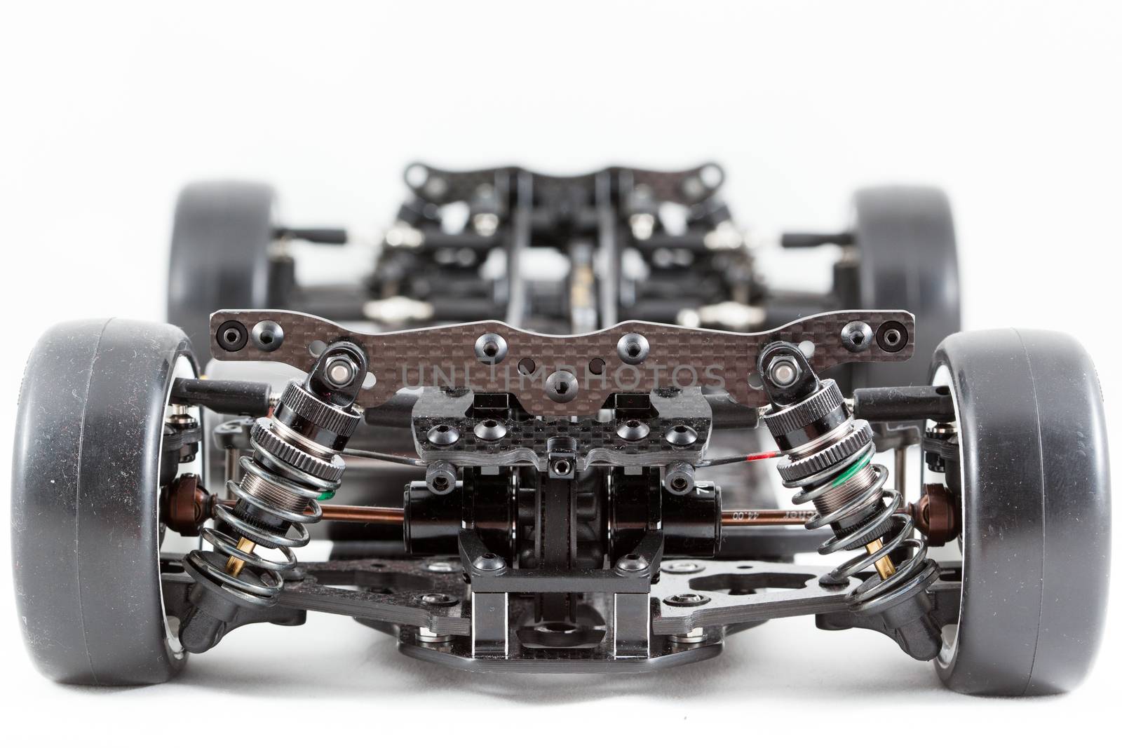 RC car chassis and parts being built to form a radio controlled race car.