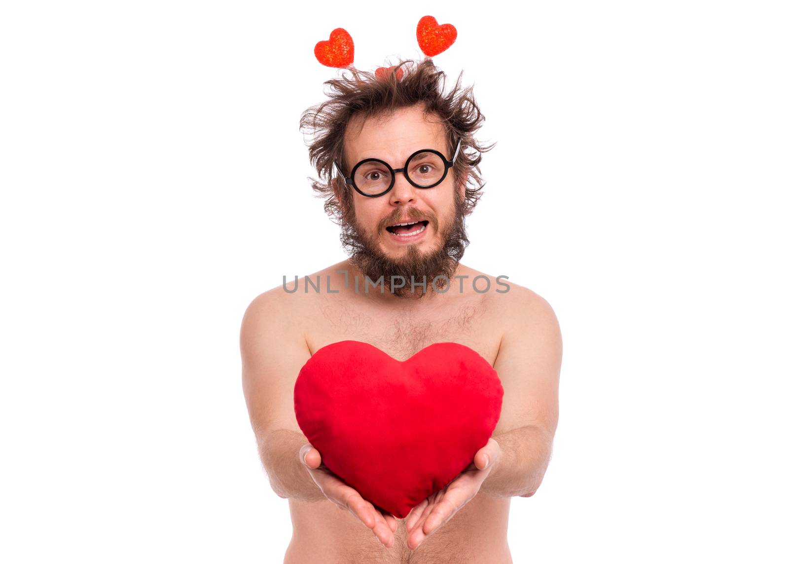 Happy Valentines Day. Crazy bearded Man with funny Haircut in eye Glasses. Happy and silly guy in Love, isolated on white background. Cheerful naked man with Red plush Heart.