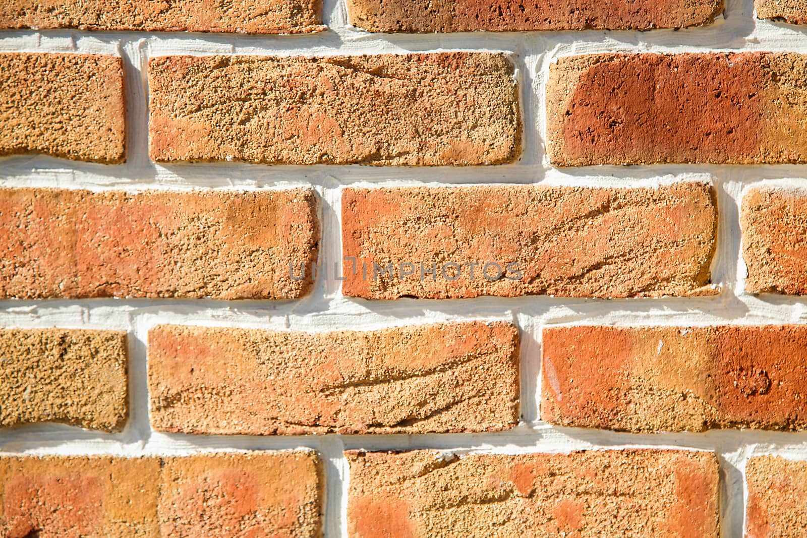 Brick wall of decorative aged brick orange.Texture.Background.