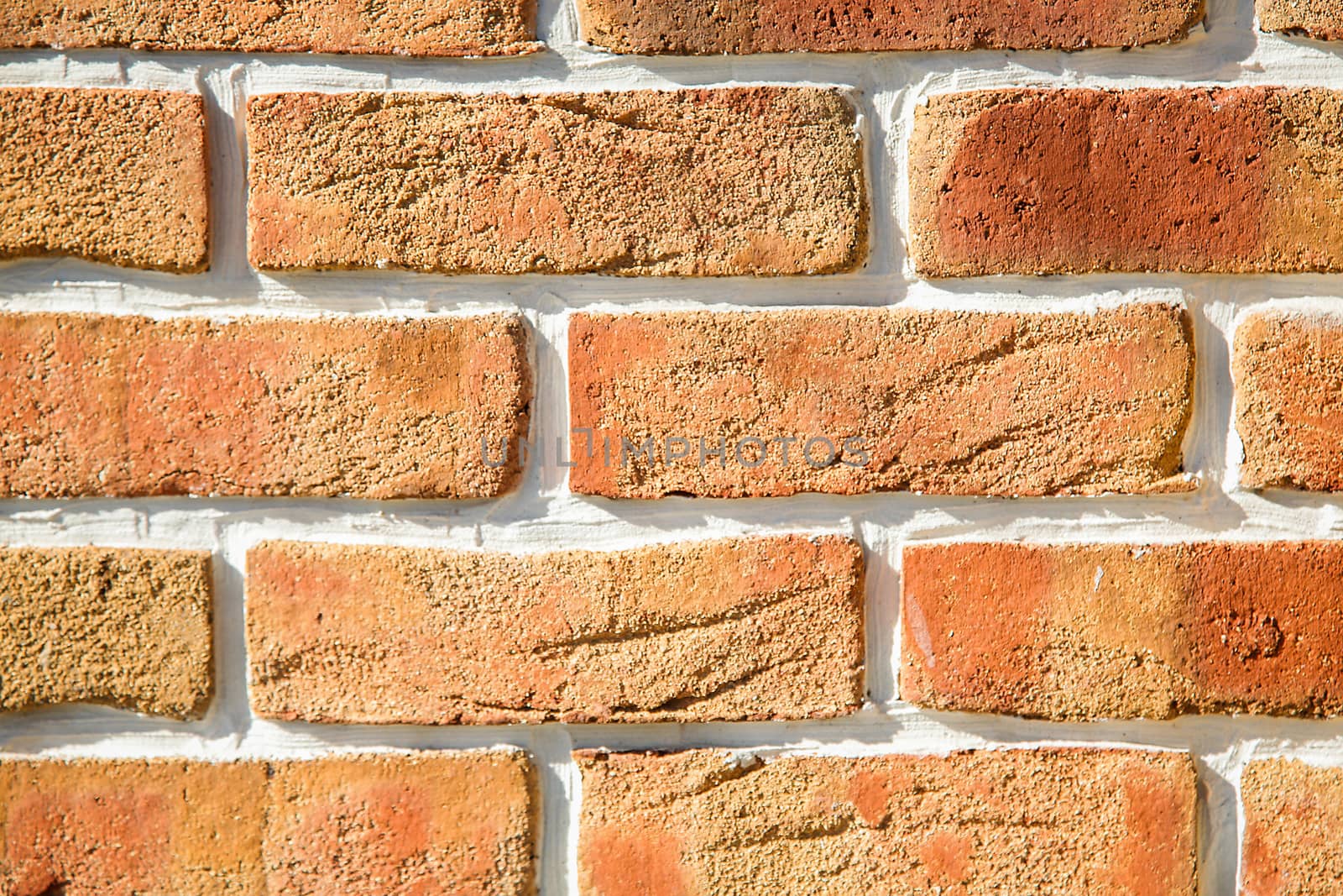 The brick wall of the cracked decorative brick is red .Texture.Background. by Mastak80