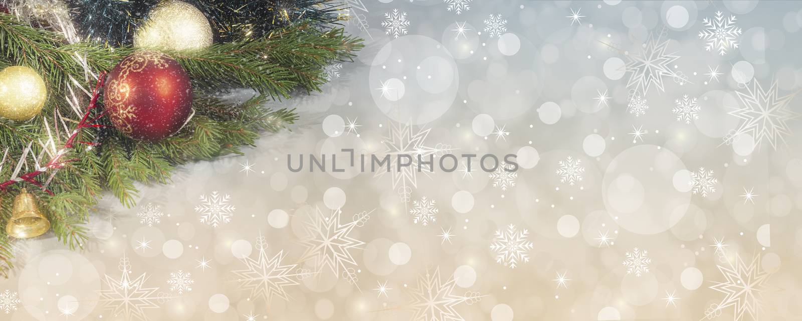 Beautiful background with bokeh and snowflakes for Christmas greeting card with decorations on the branches of the Christmas tree. Banner, copy of the space.