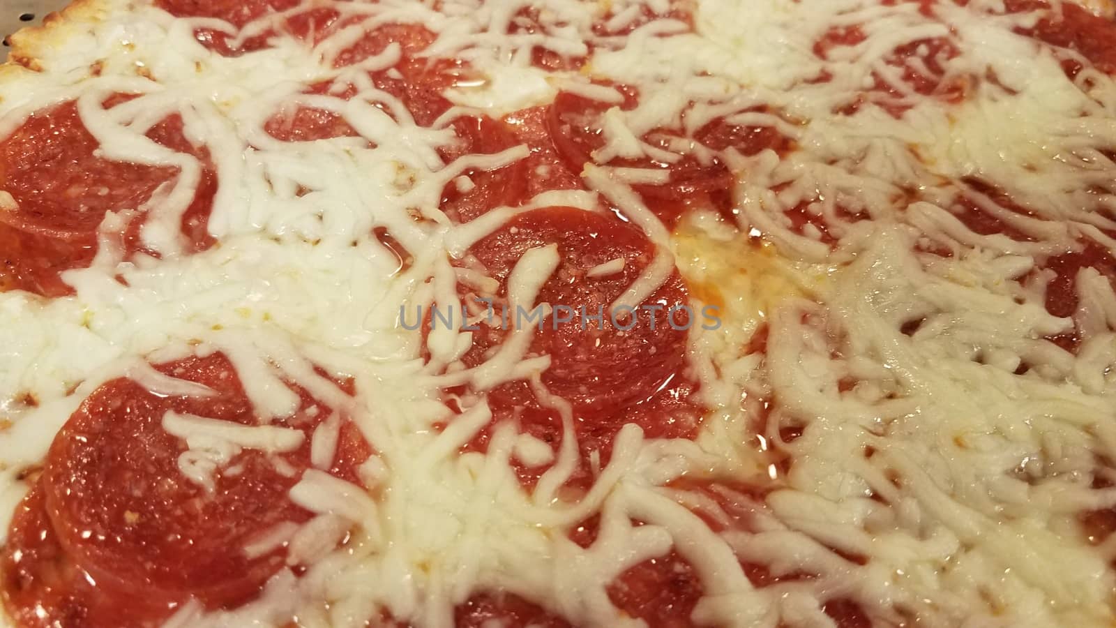 pepperoni meat pizza with melted cheese and grease