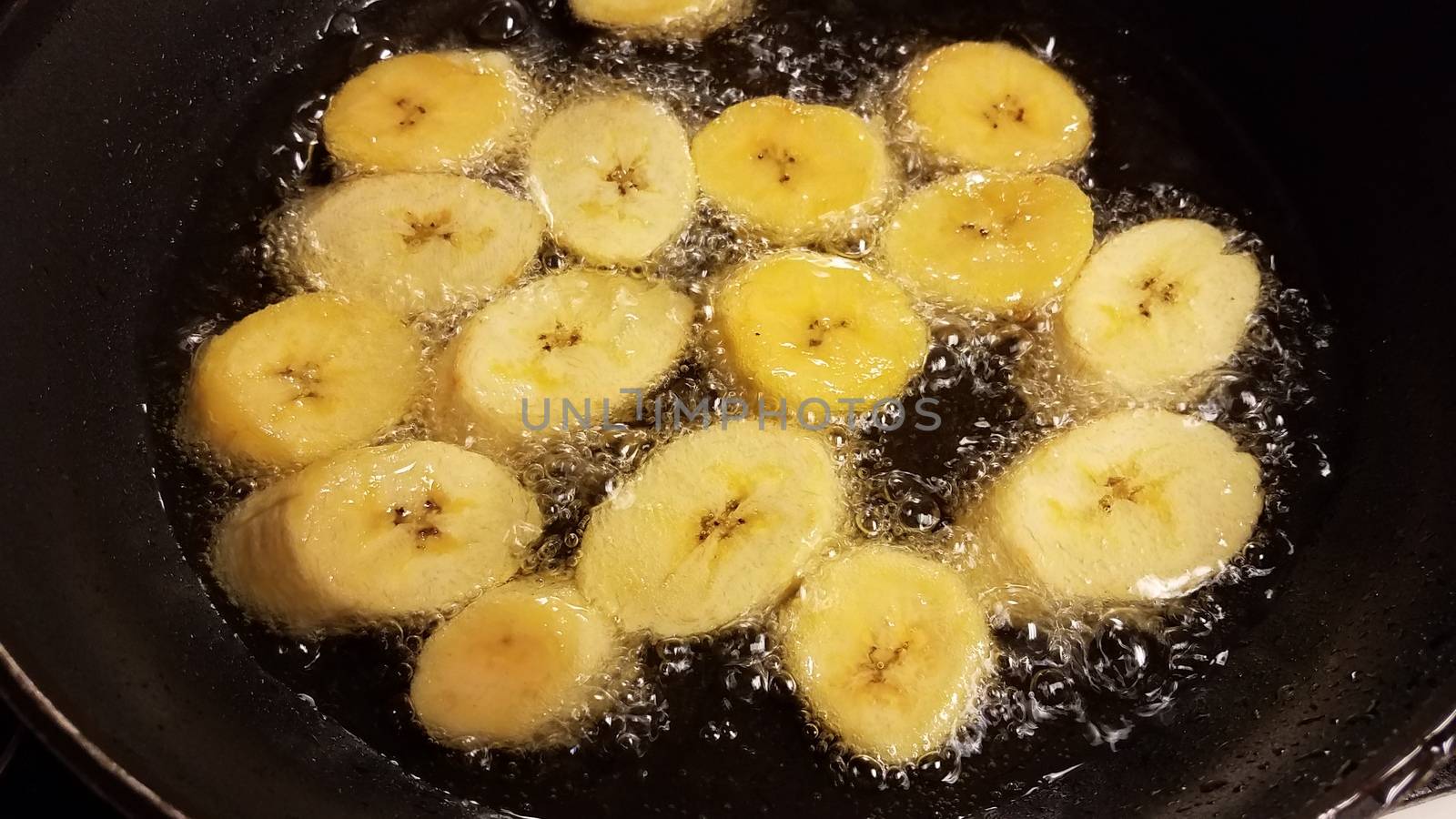 plantain banana from Puerto Rico boiling in oil by stockphotofan1