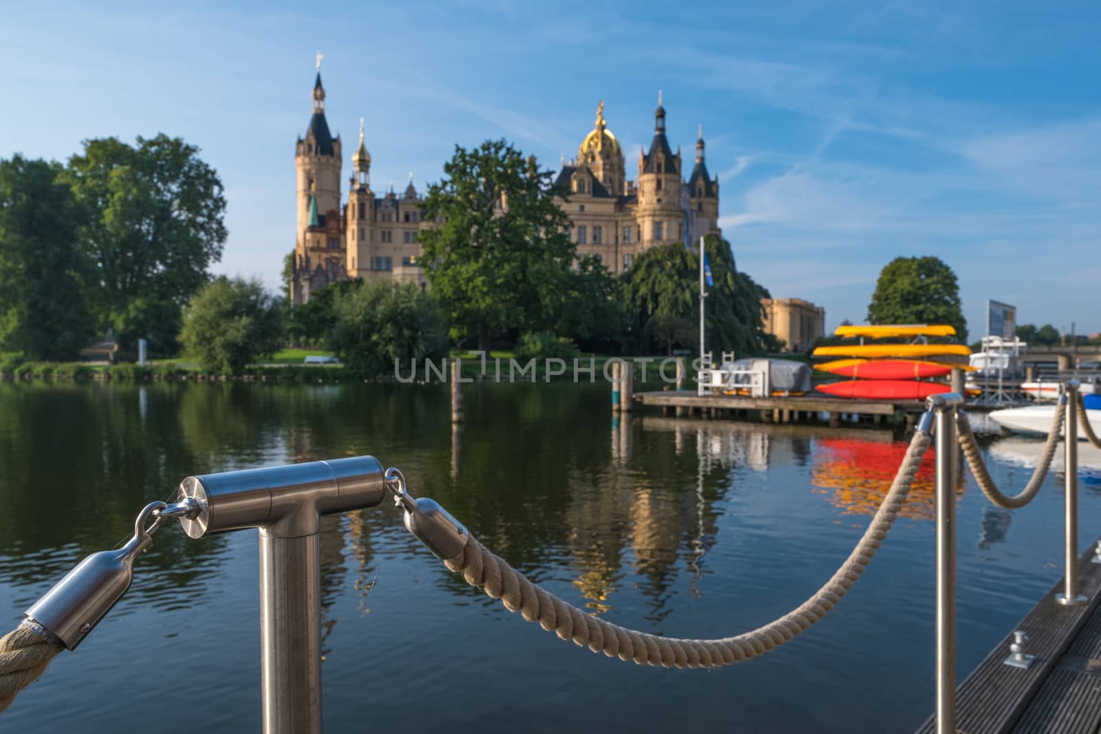 Beautiful fairytale castle in Schwerin, view from the pier.