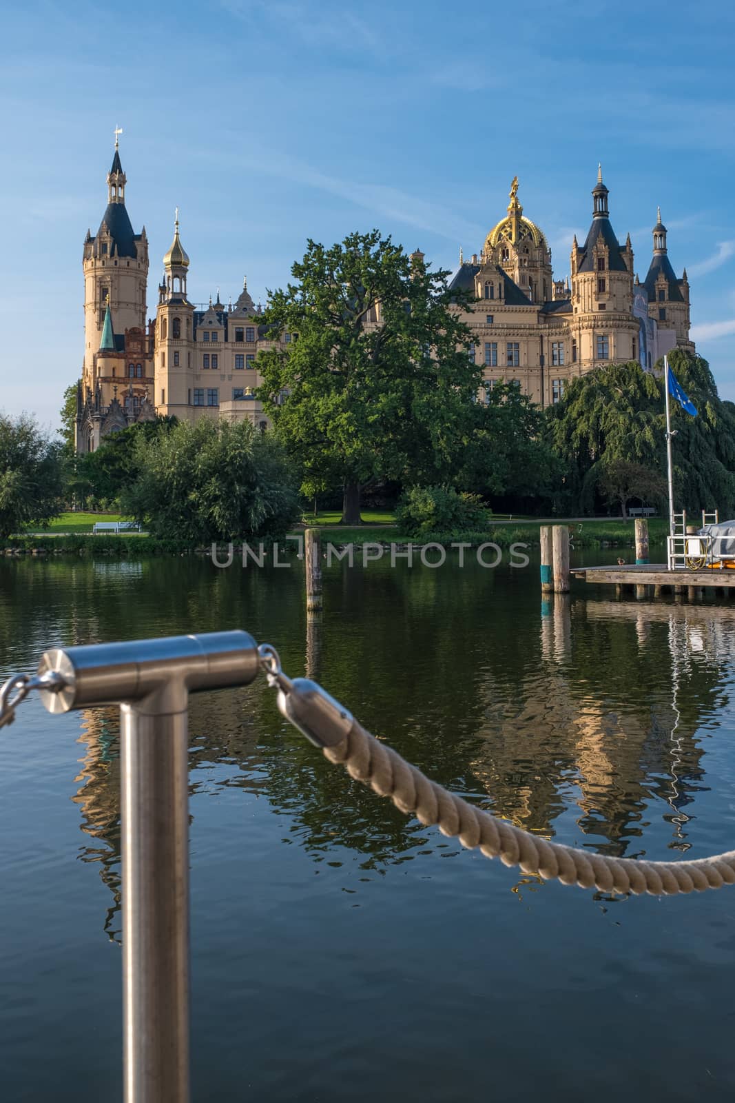 Beautiful fairytale castle in Schwerin, view from the pier.