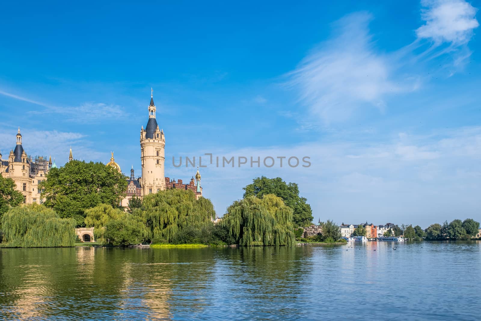 A beautiful fairy-tale castle in Schwerin, the view from the lake.