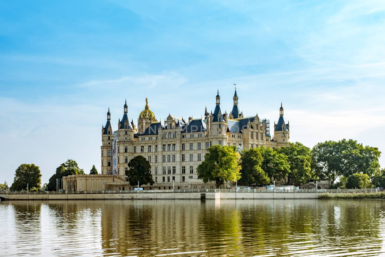 A beautiful fairy-tale castle in Schwerin, the view from the lake by Fischeron