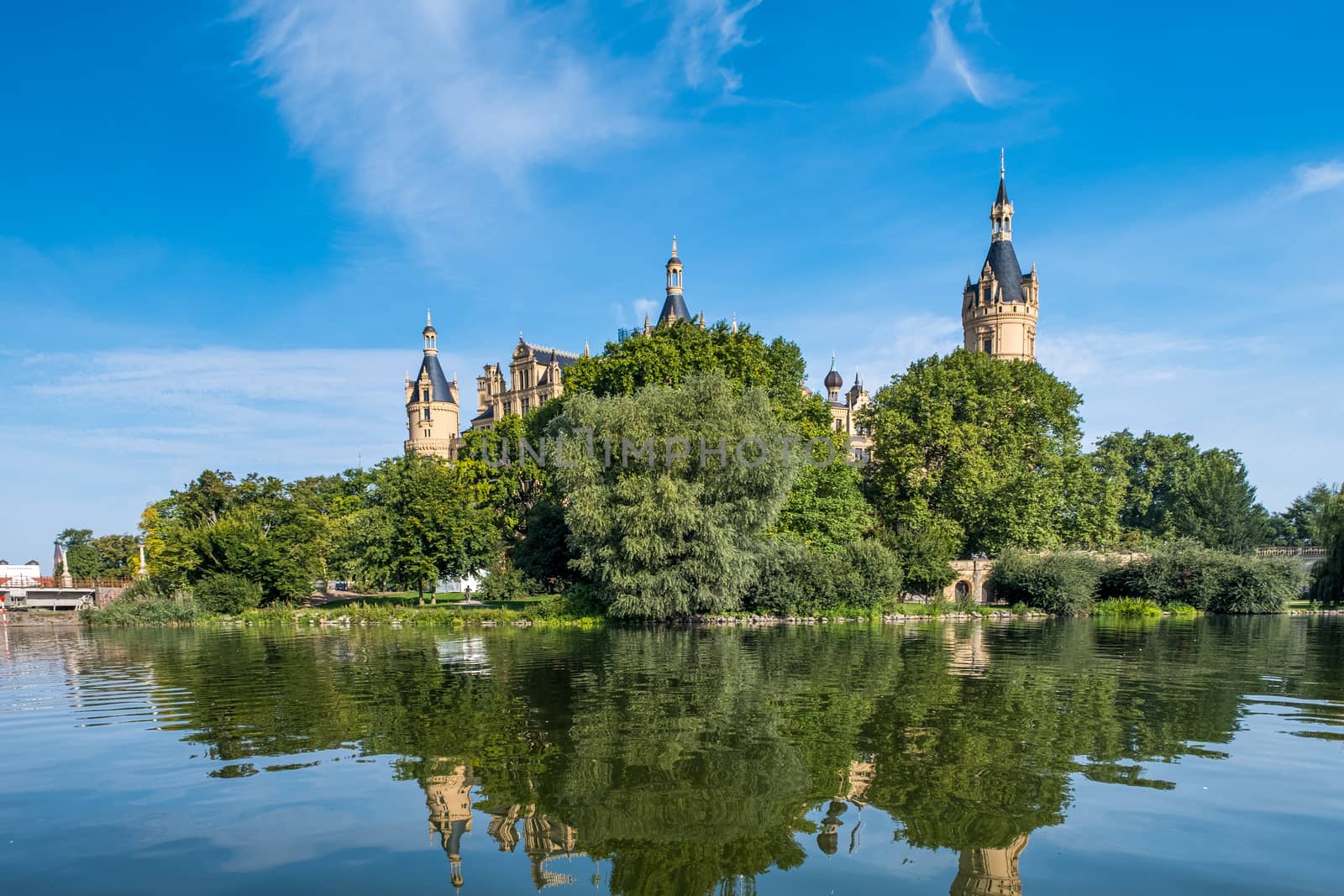 A beautiful fairy-tale castle in Schwerin, the view from the lake by Fischeron