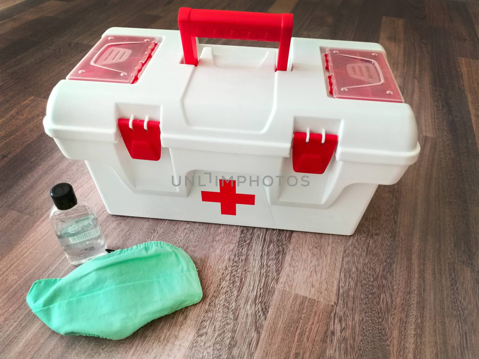 Prevention of the flu virus home first aid kit with a protective face mask and hand sanitizer .Texture or background
