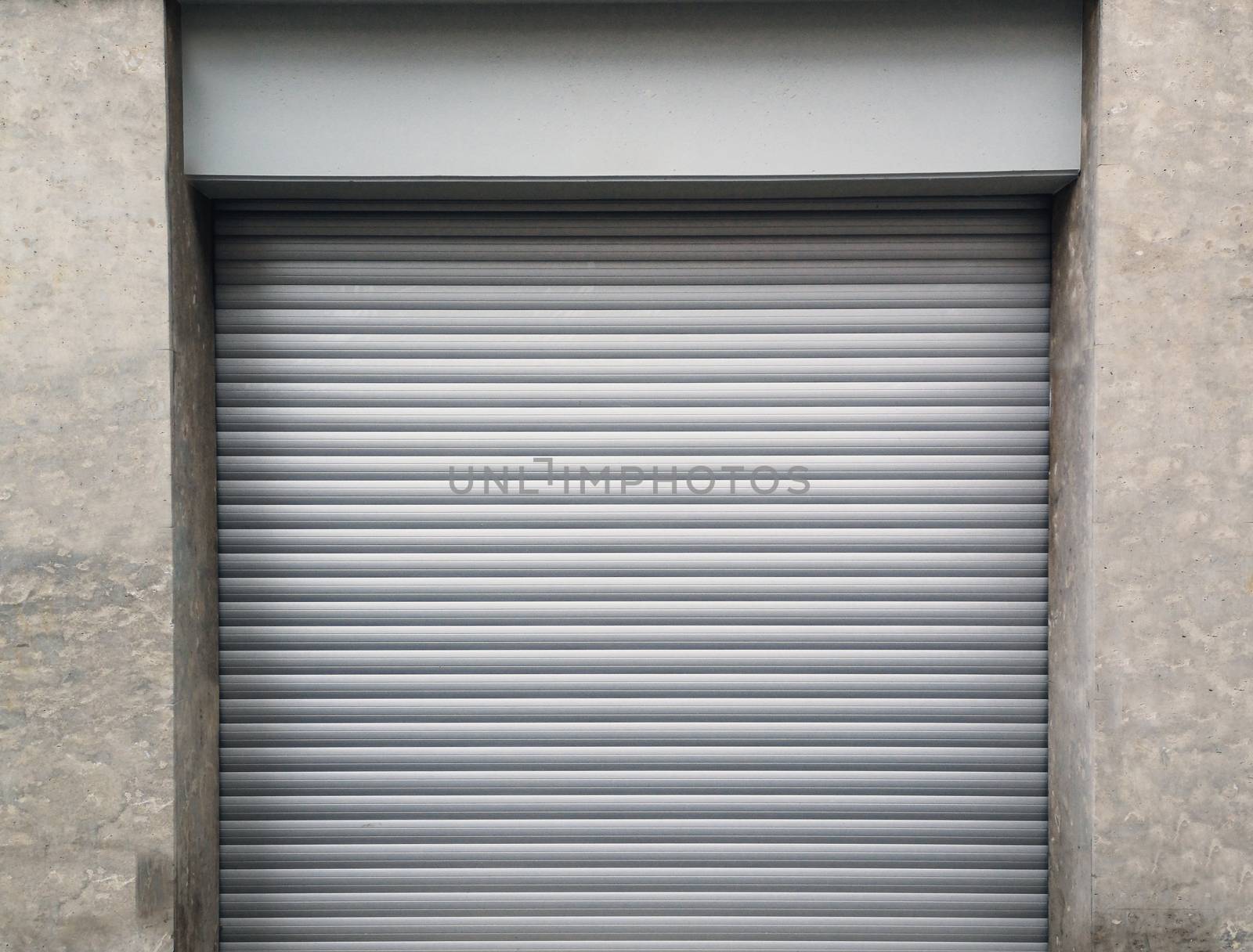 The garage's metal roller shutters are closed .Texture or background