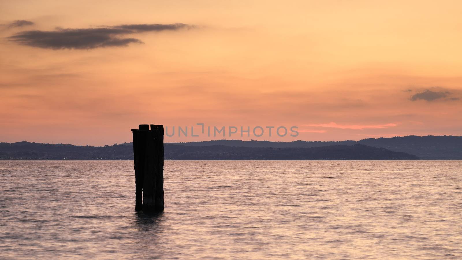 Sunset over Lake Garda in Italy viewed from the Sirmione waterfront.