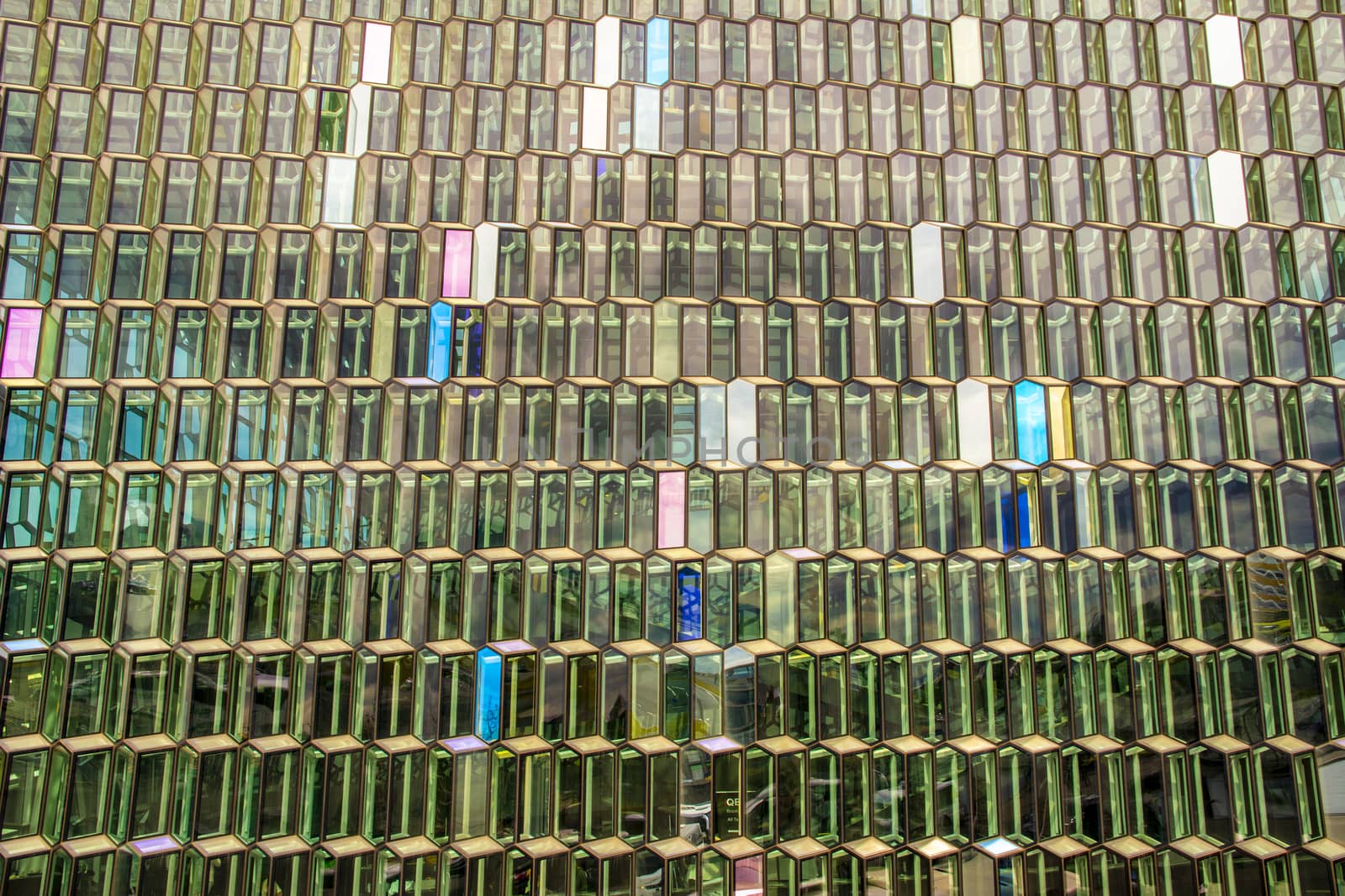 Architecture close-up and detail of the Glass window design of the Harpa concert hall and conference centre by kb79