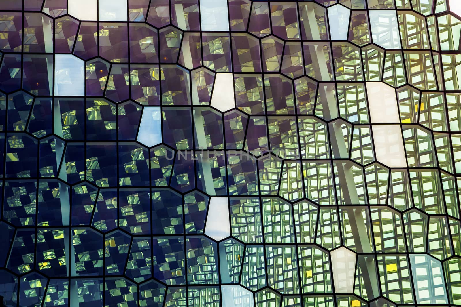 Reykjavik, Iceland, July 2019: Architecture close-up and detail of the Glass window design of the Harpa concert hall and conference centre