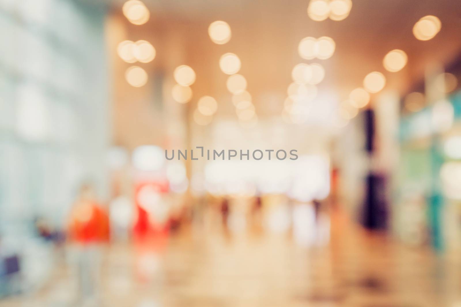 abstract blur bokeh light in department store colorful background concept.