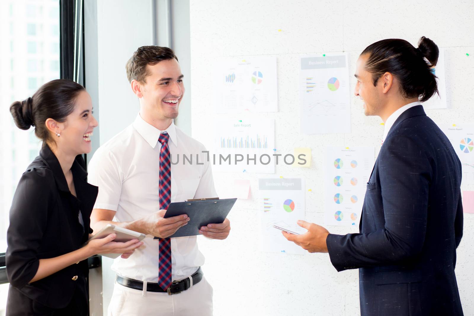 young businessman holding clipboard with present profit and secr by nnudoo