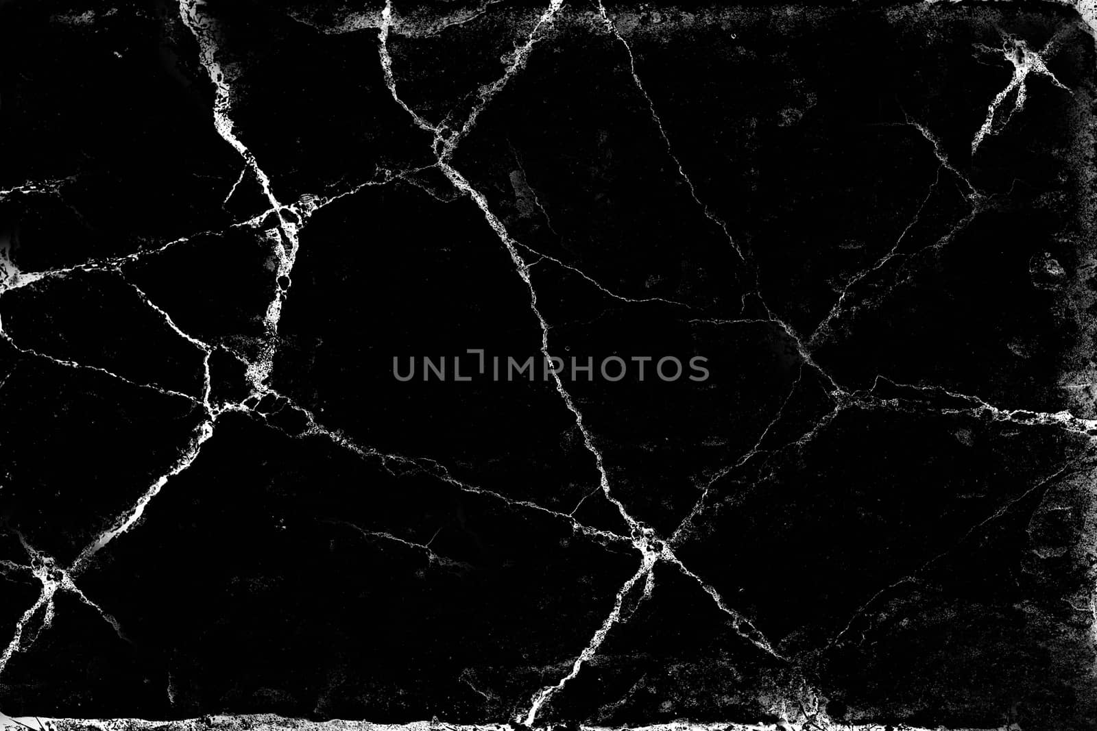 Black aged wall surface with large white cracks .Texture or background.