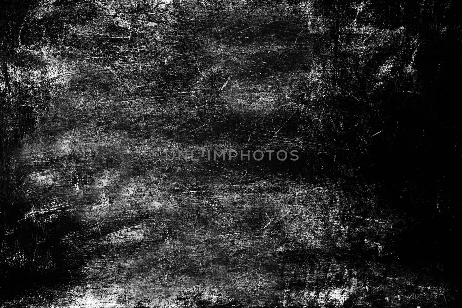 The surface of the wall is rough and heavily scratched black . Texture or background